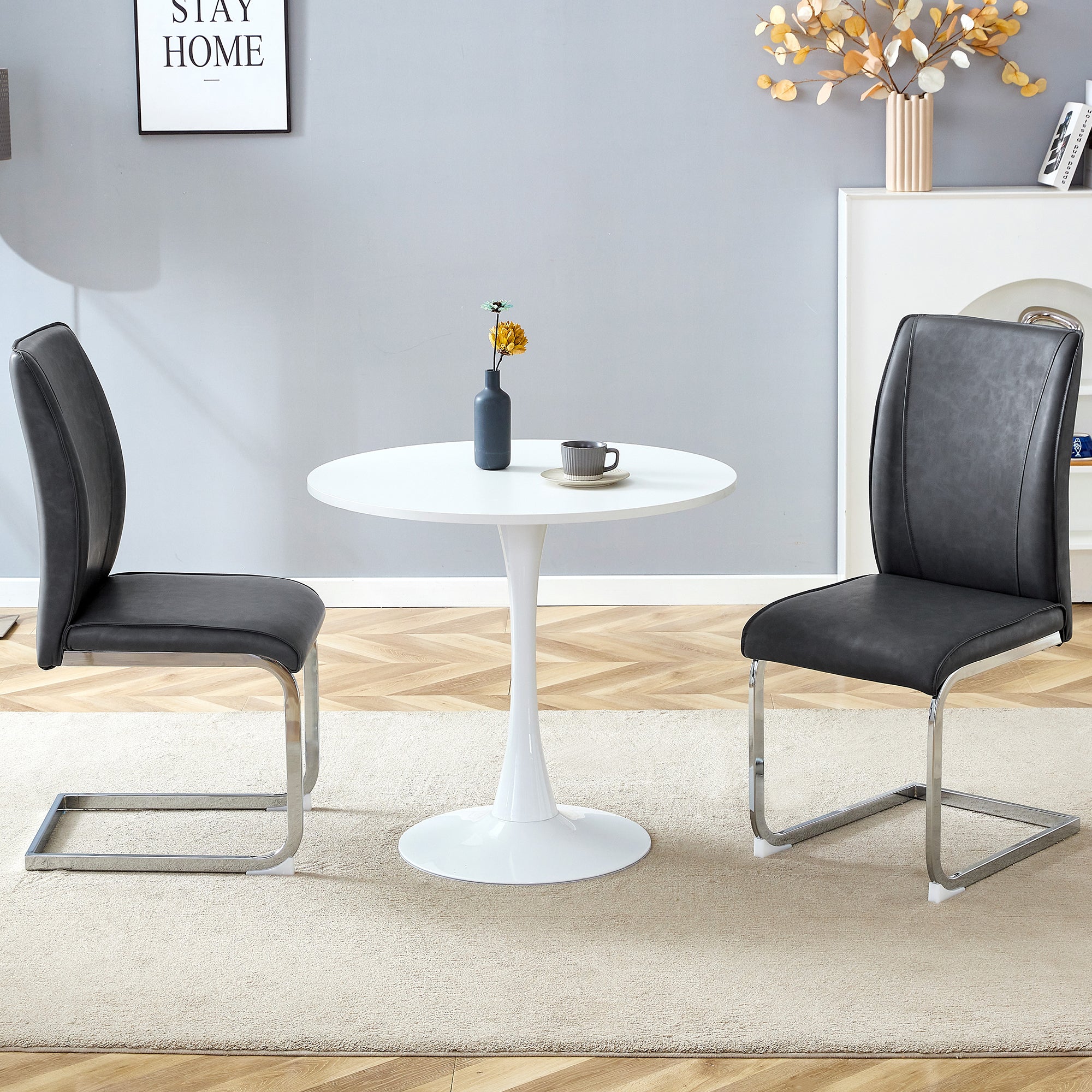 Table and chair set.Hourglass-Shaped Stable Small Round Table -31.9' * 31.9' With 2 Soft and Comfortable Dark Gray PU Chair With Arched Metal Silver Leg.Create Your Exclusive Low-Key Luxury Space.