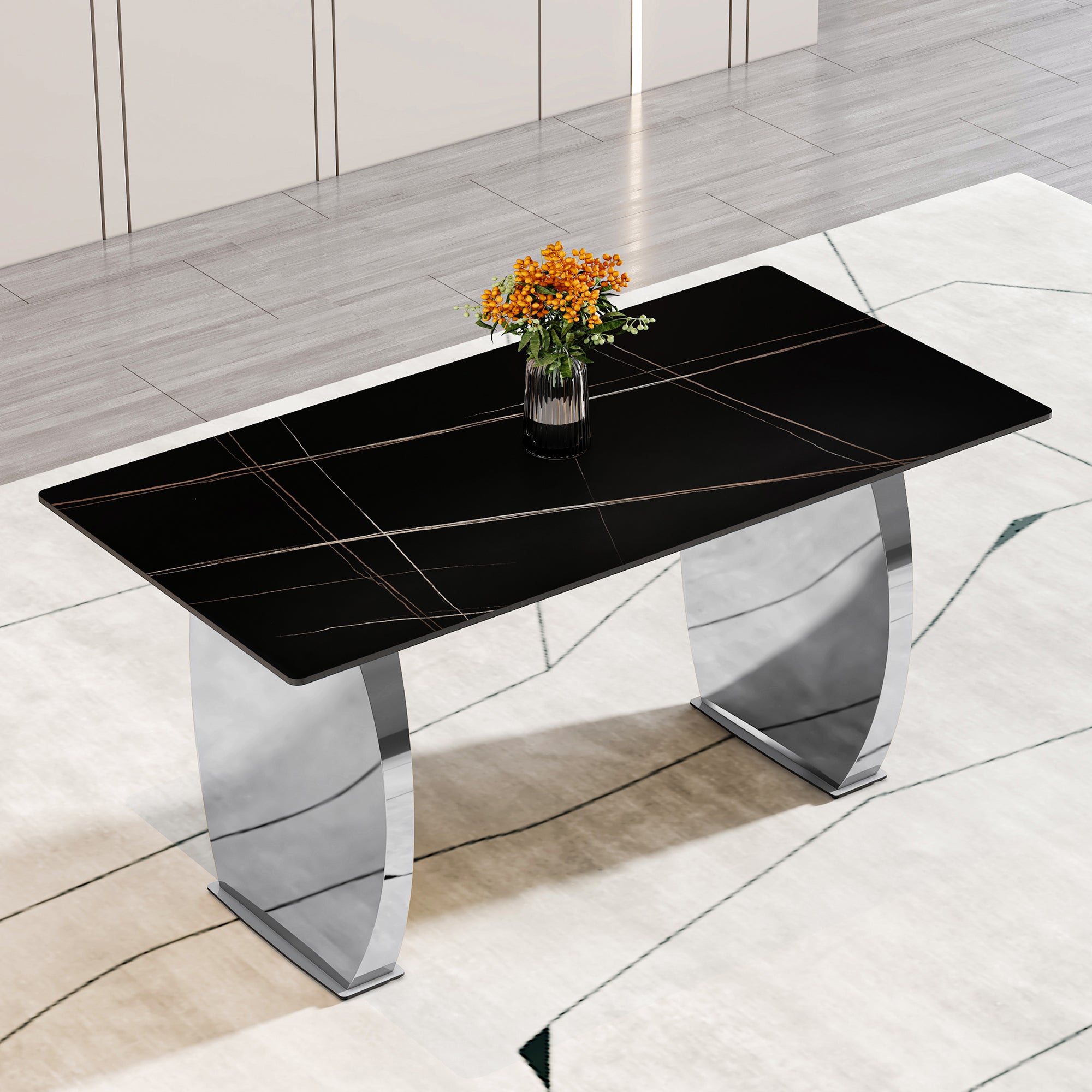 Modern rectangular table with 0.4 inch black patterned tabletop and silver legs, suitable for kitchen, dining room, and living room.63*31.4 Inch Black Patterned Sintered Stone Tabletop op.