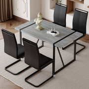 Table and chair set. Modern minimalist grey marble textured MDF dining table with metal frame.Paired with 4 black PU chairs with Black Featuring arched black legs.