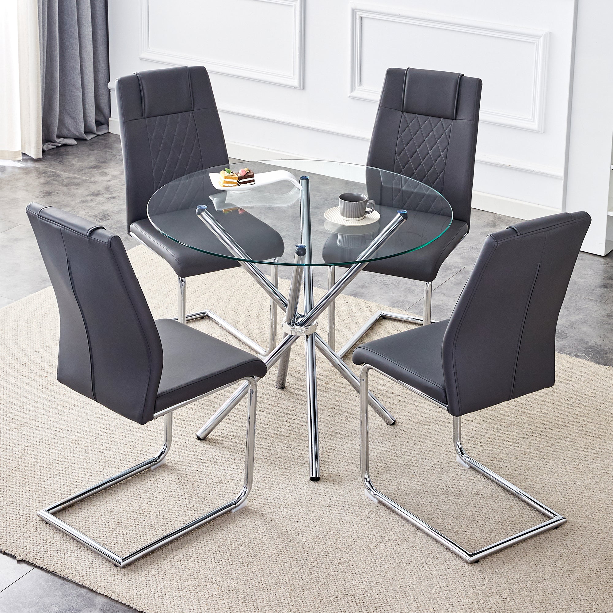 Table and chair set.36.6'Round clear glass dining table with a unique shape with ring-shaped gathered silver metal legs.Paired with 4 Dark gray high-quality PU dining chairs with silver metal legs.