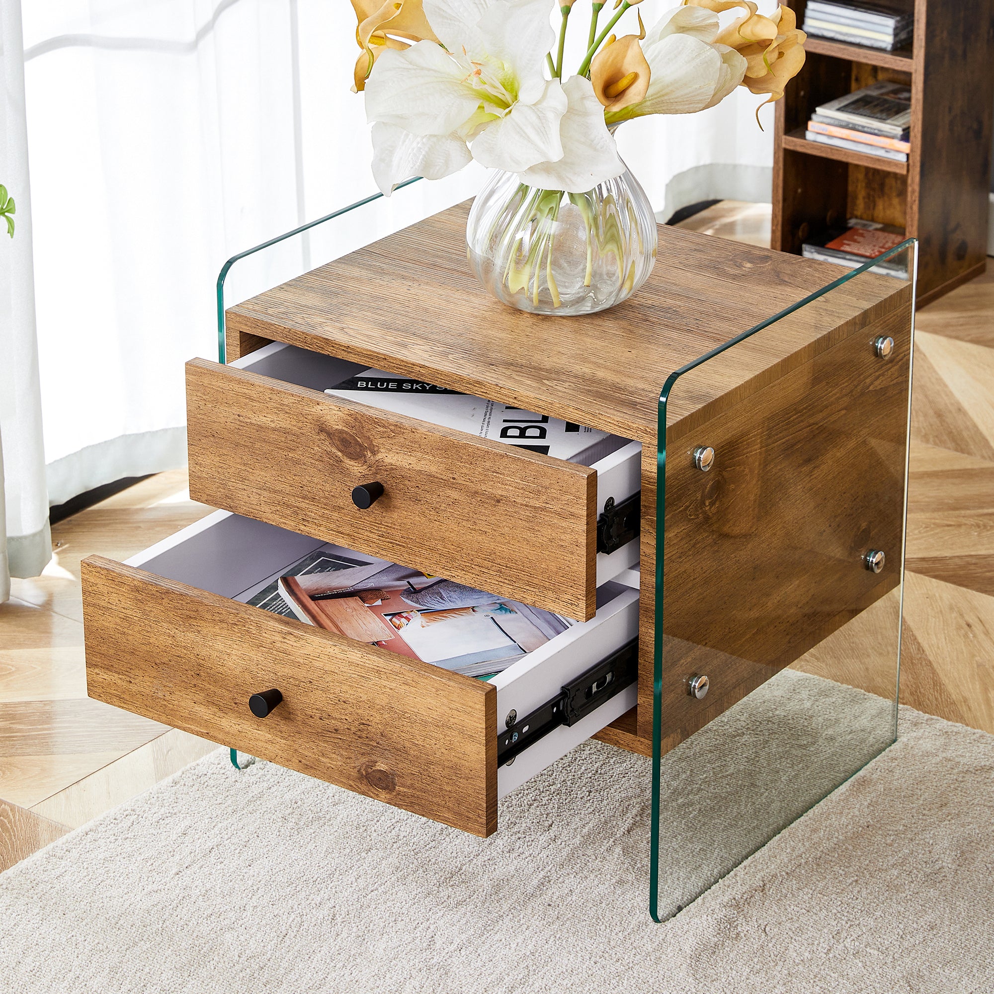 Double-drawer bedside table.The board surface is MDF with wood grain sticker, and both sides are tempered glass. The design is simple and elegant, with excellent storage functions.