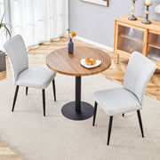 Table and chair set.31.5 Inch Dark Wood Grain Round Dining Table - Suction Molding Annular Texture.Paired with 2 Light Gray PU chairs with a vertical stripe design on the backrest.