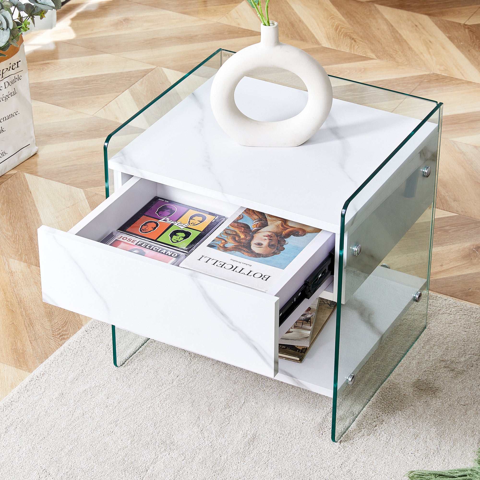 Bedside table with drawers. The board surface is MDF with white grain sticker, and both sides are transparent tempered glass. The design is simple and elegant, with excellent storage functions.