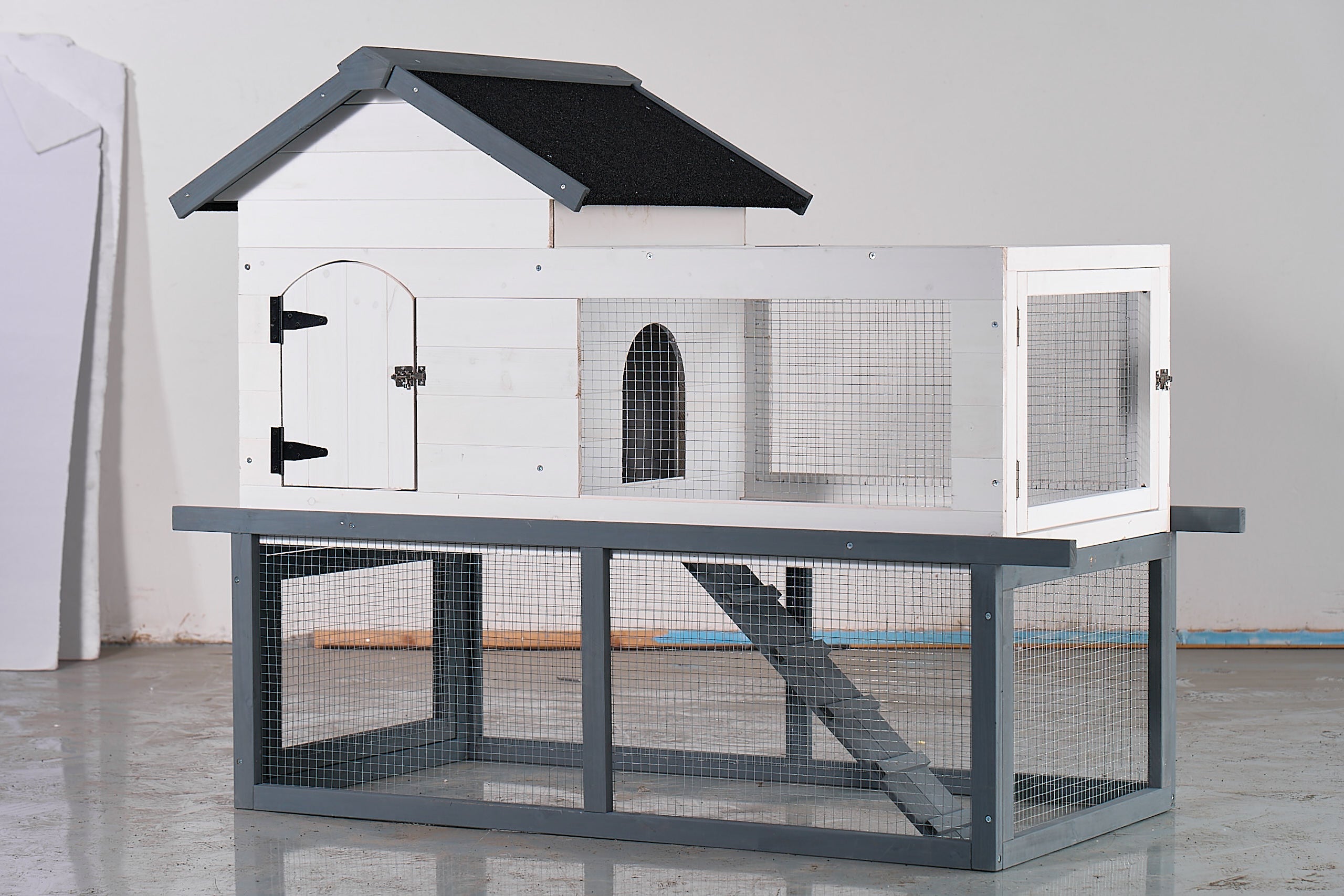 53-inch double-tier wooden outdoor/indoor waterproof chicken coop and rabbit hutch complete with a roof, stairs, and a removable cleaning tray; suitable for small to medium pets.