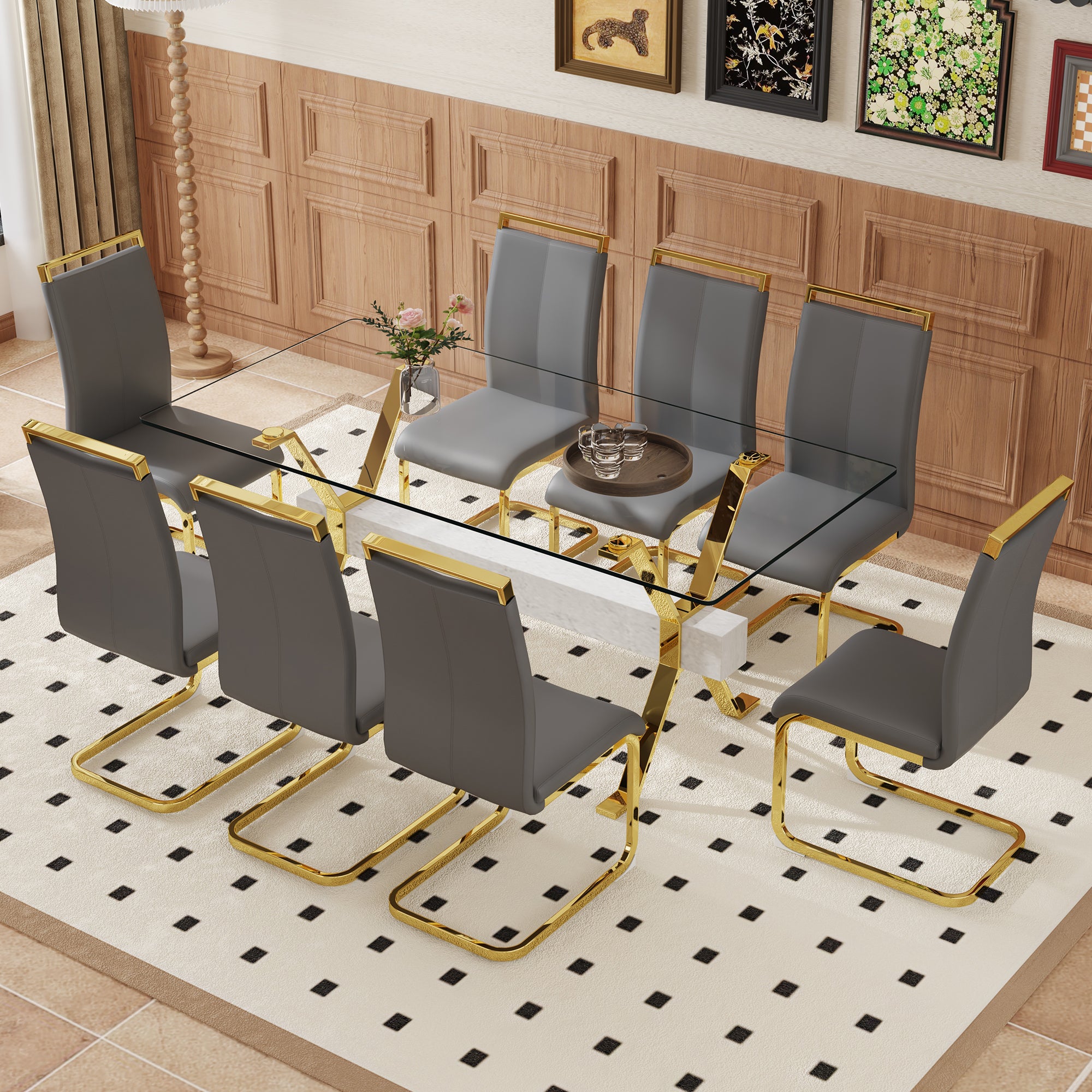 Table and chair set.Elegant Transparent Tempered Glass Dining Set - 71'x35.4' with 8 Dark Gray PU Chairs with golden C-tube metal leg.
