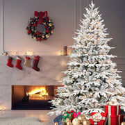 9ft Pre-Lit Flocked Artificial Christmas Tree with 1050 Warm White Incandescent Lights, 5069 Tips, Snowy PE+PVC Hinged Pine with Partial Memory Wire Branches, Foldable Metal Stand for Holiday Dec